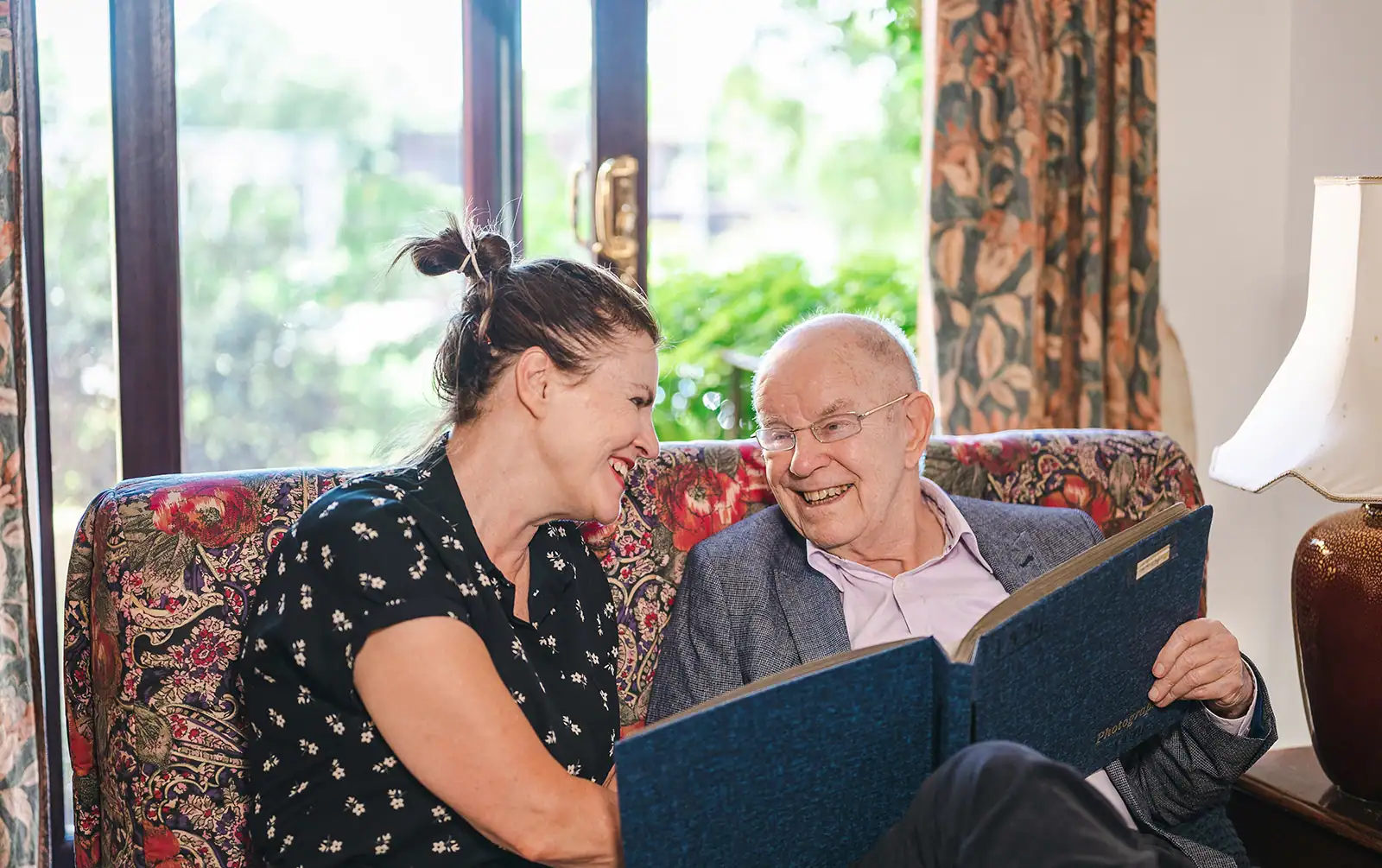 A father showing his daughter some stories