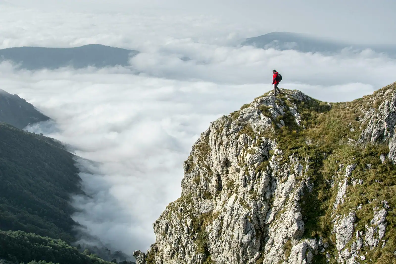 An experience seeker standing on a mountain