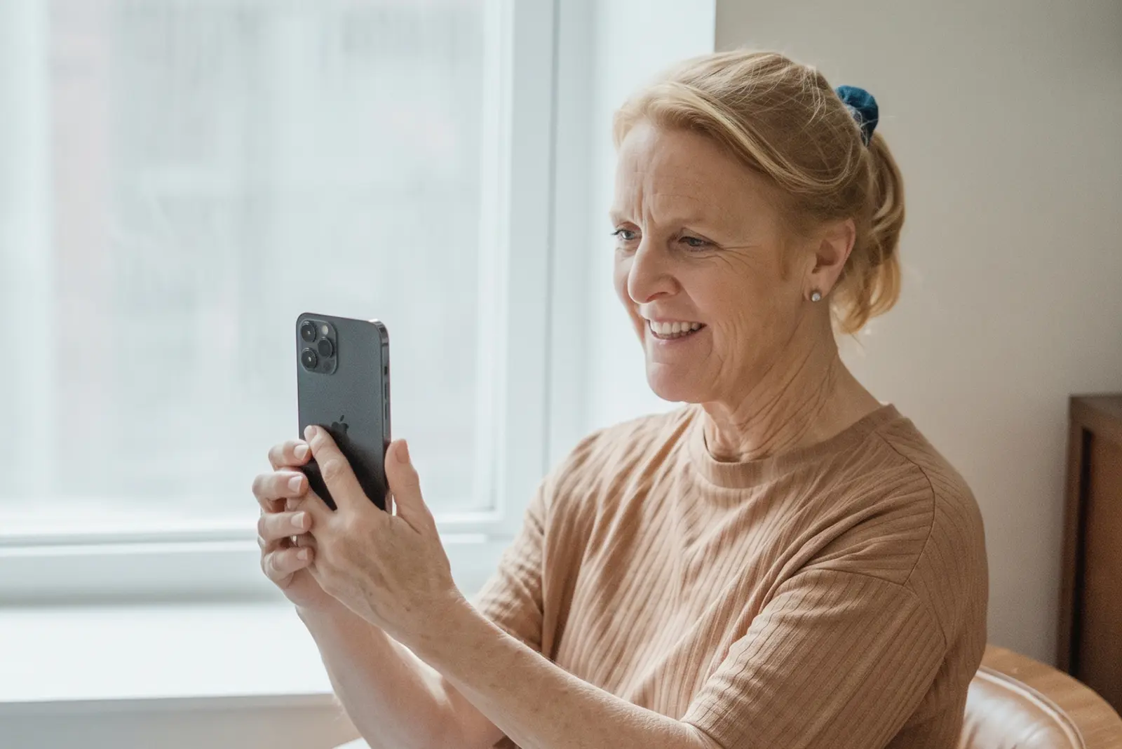 Parent comfortably recording a story on their phone