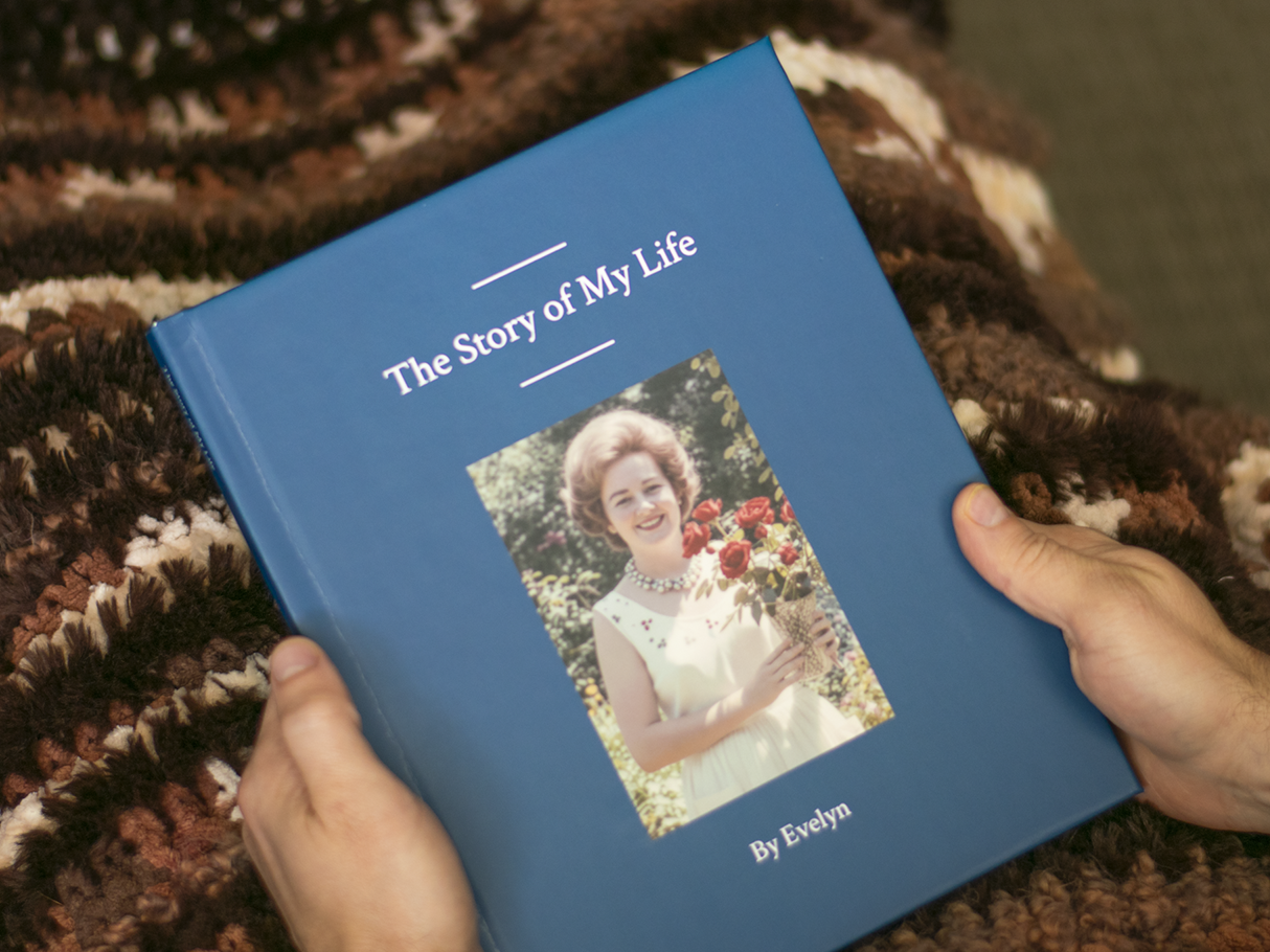 Finished keepsake book being held by a family member